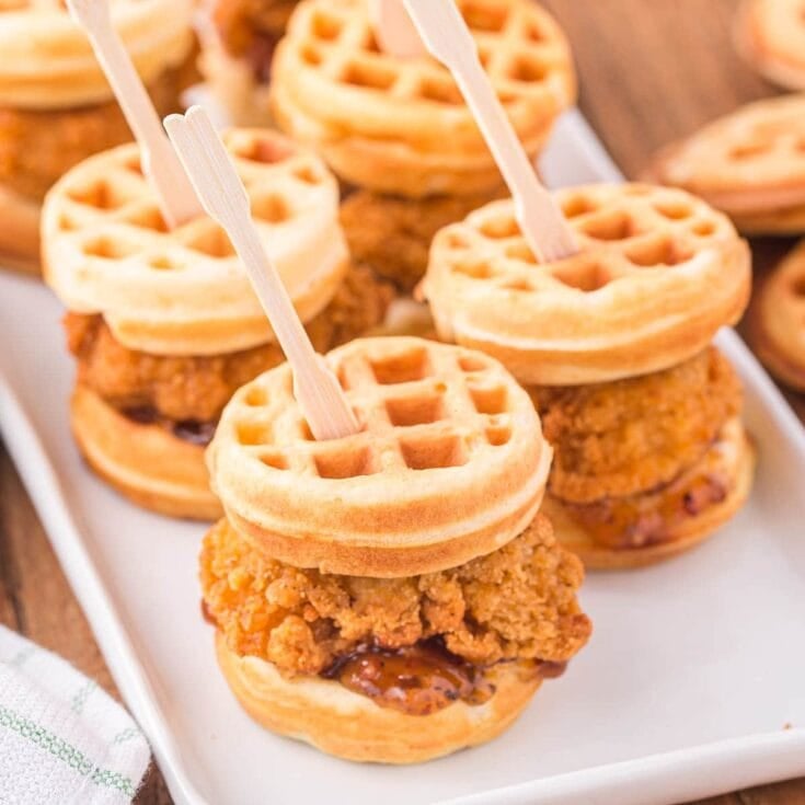 a couple of Chicken and Waffle Sliders on the plate.
