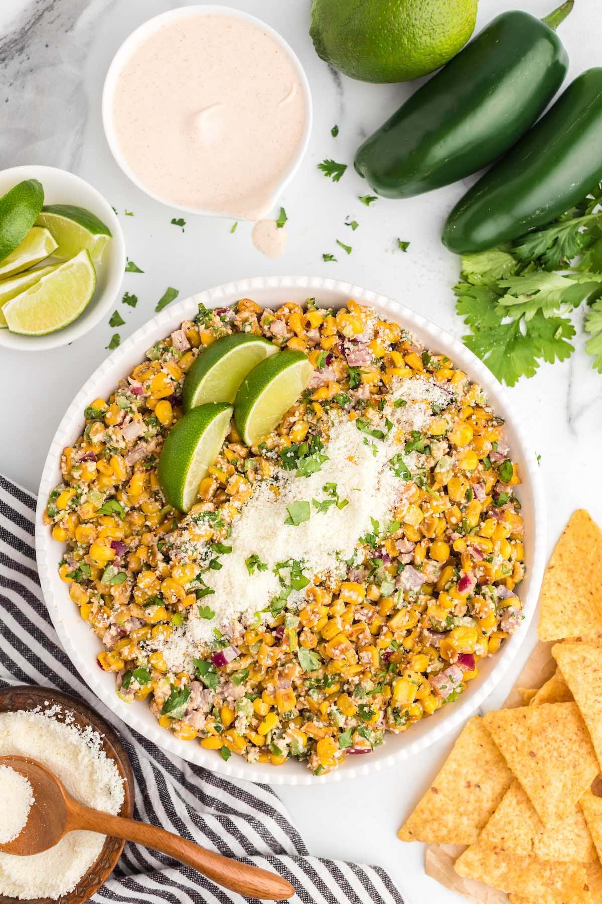 mexican corn salad in a bowl served with cotija cheese.