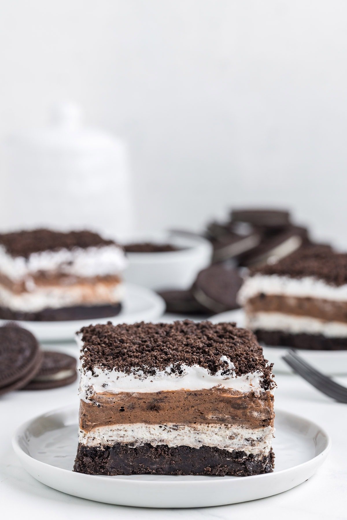 a slice of of Oreo Lasagna with crushed Oreo on top.