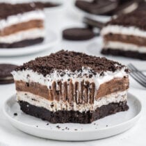 a slice of Oreo Lasagna on a white plate.