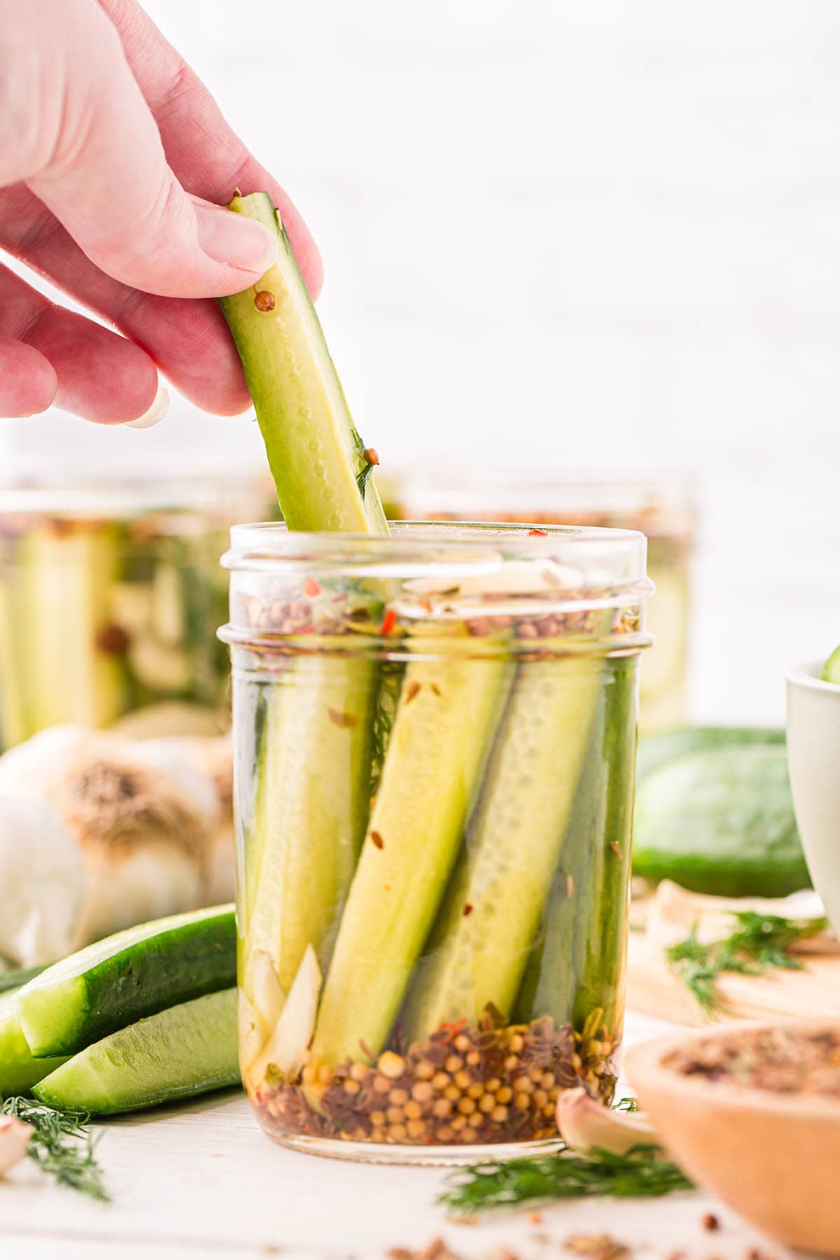 hand holding a Refrigerator Dill Pickles.