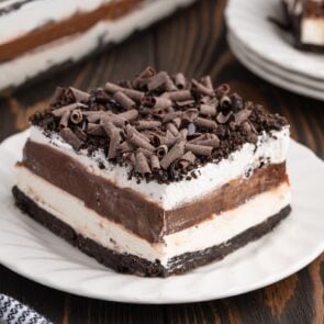 a slice of chocolate lasagna on a while plate