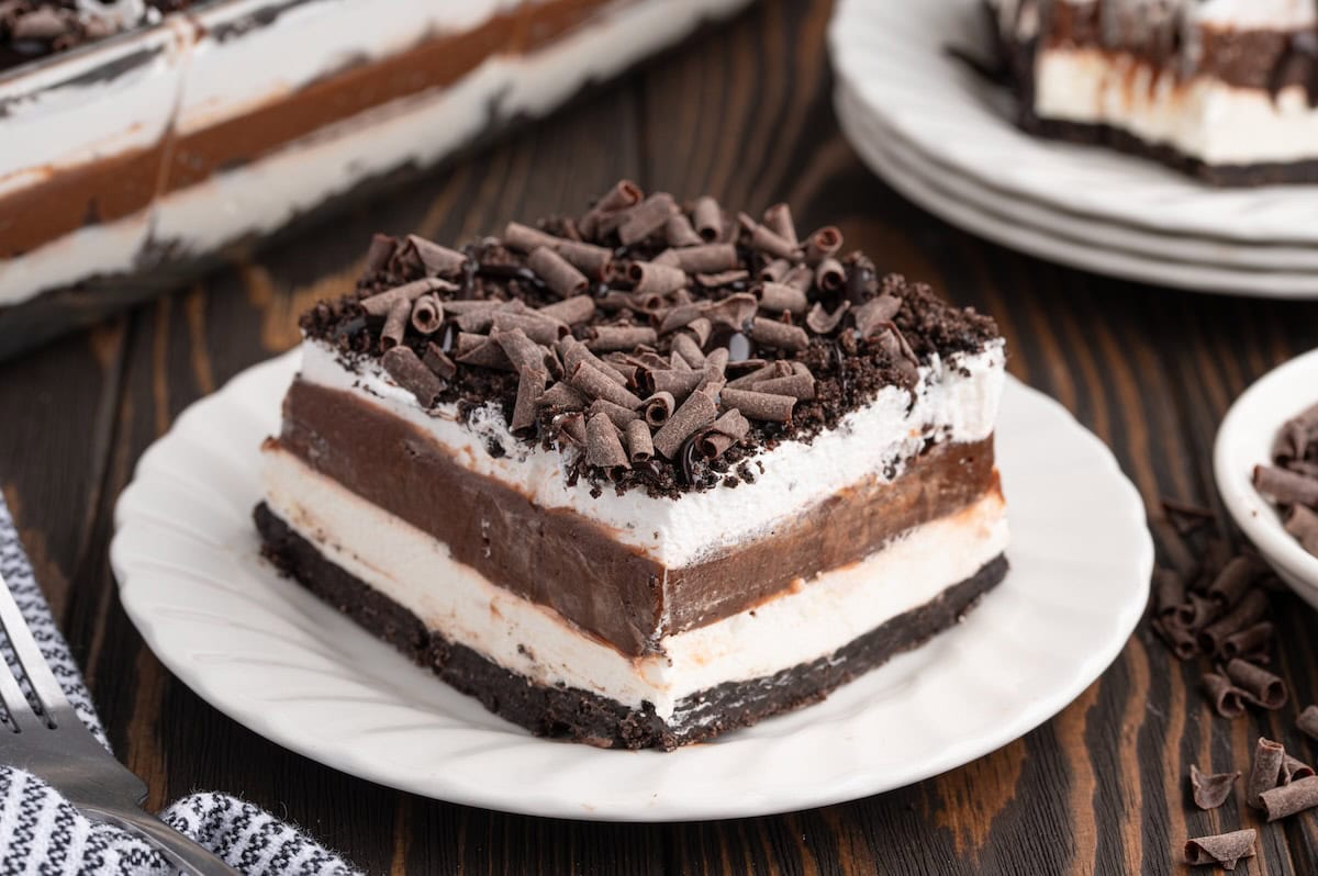 a slice of chocolate lasagna on a while plate