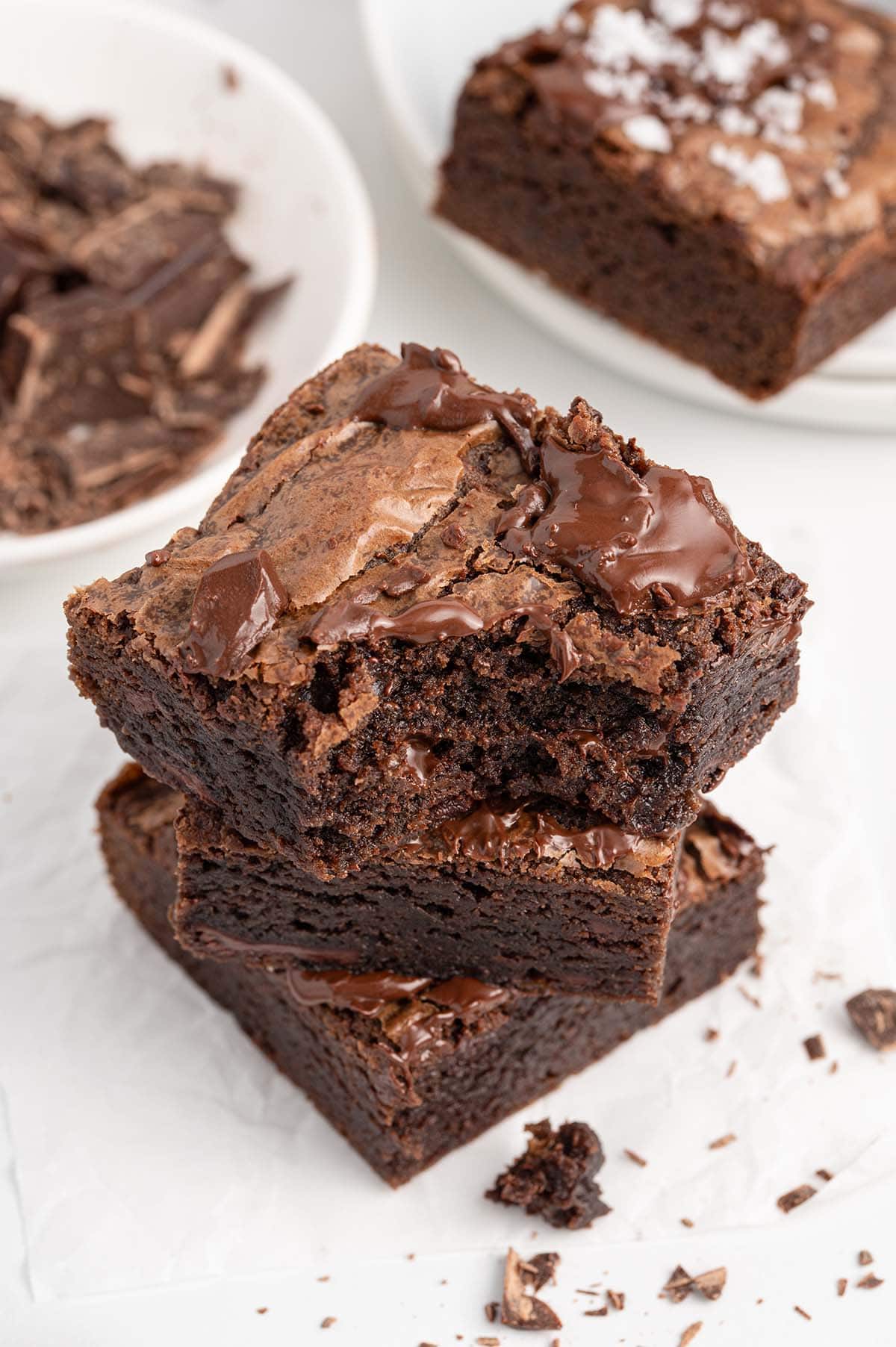 bitten brownie stacked on top of other brownie. 