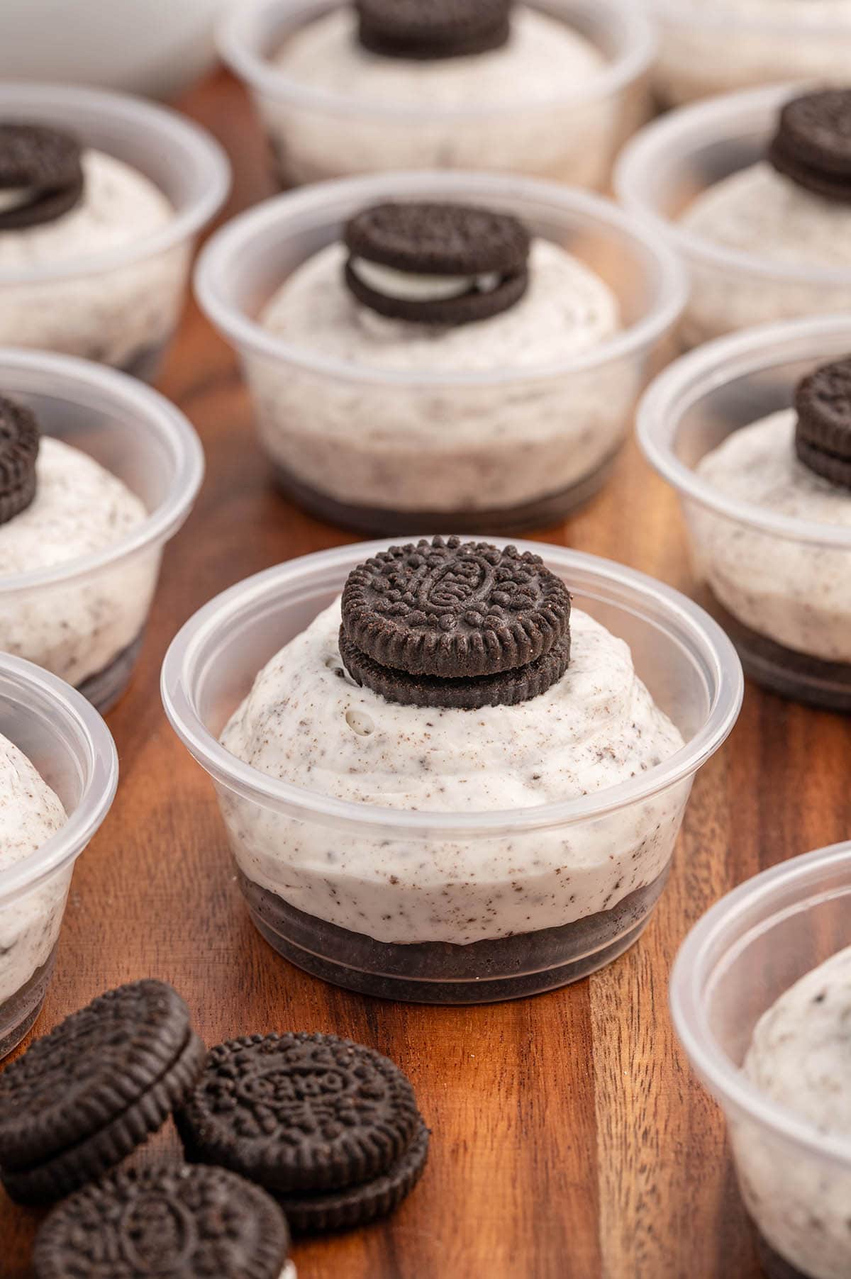 a couple of Oreo Dessert Cups with oreo minis on top.