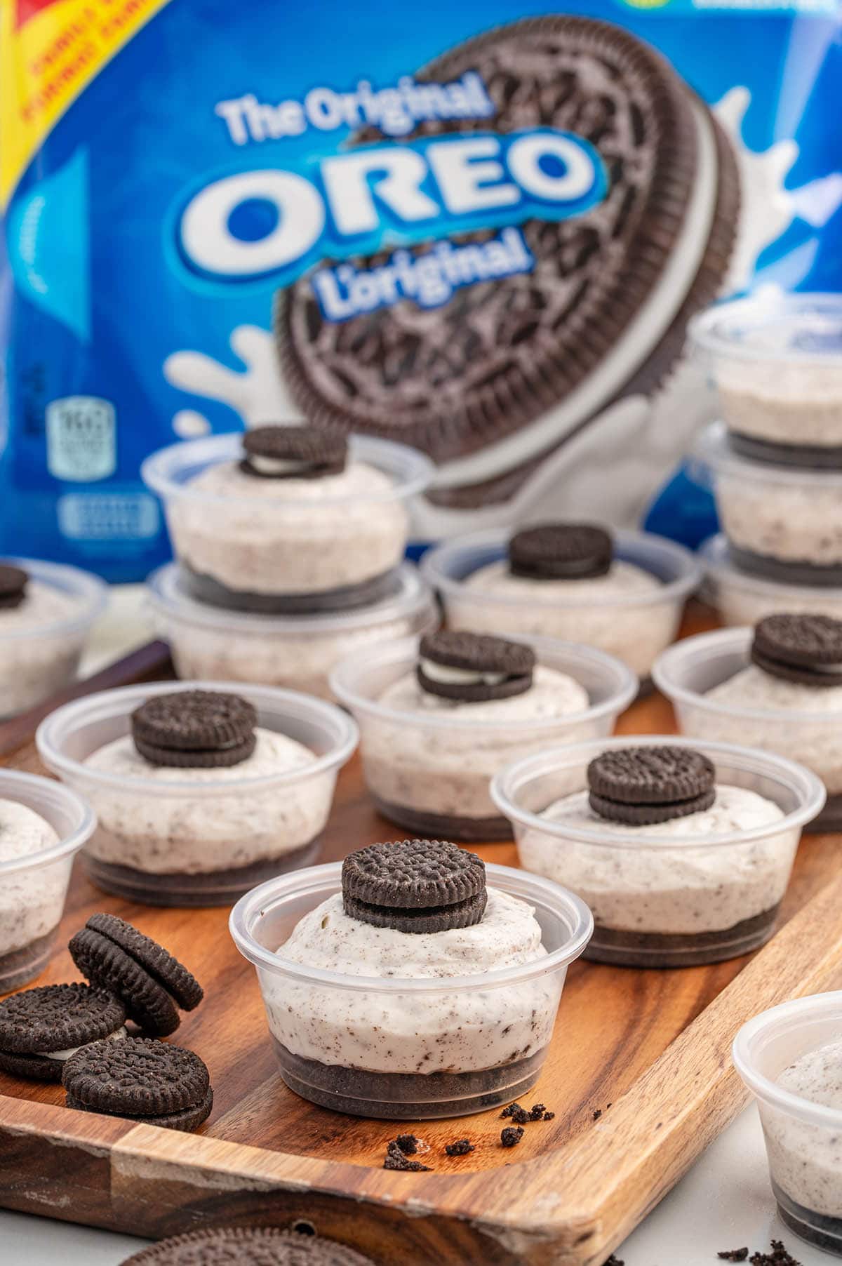 a couple of Oreo Dessert Cups on the table with a package of oreos in the background.