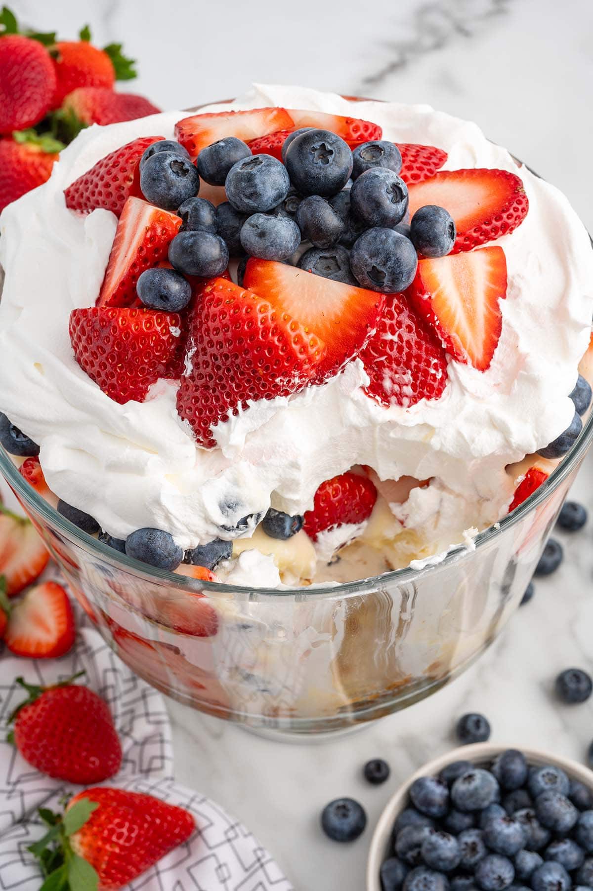 4th of july trifle topped with cool whip, strawberries and blueberries.
