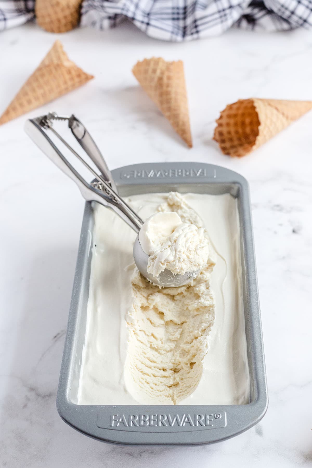 a scoop of vanilla ice cream in a pan. 