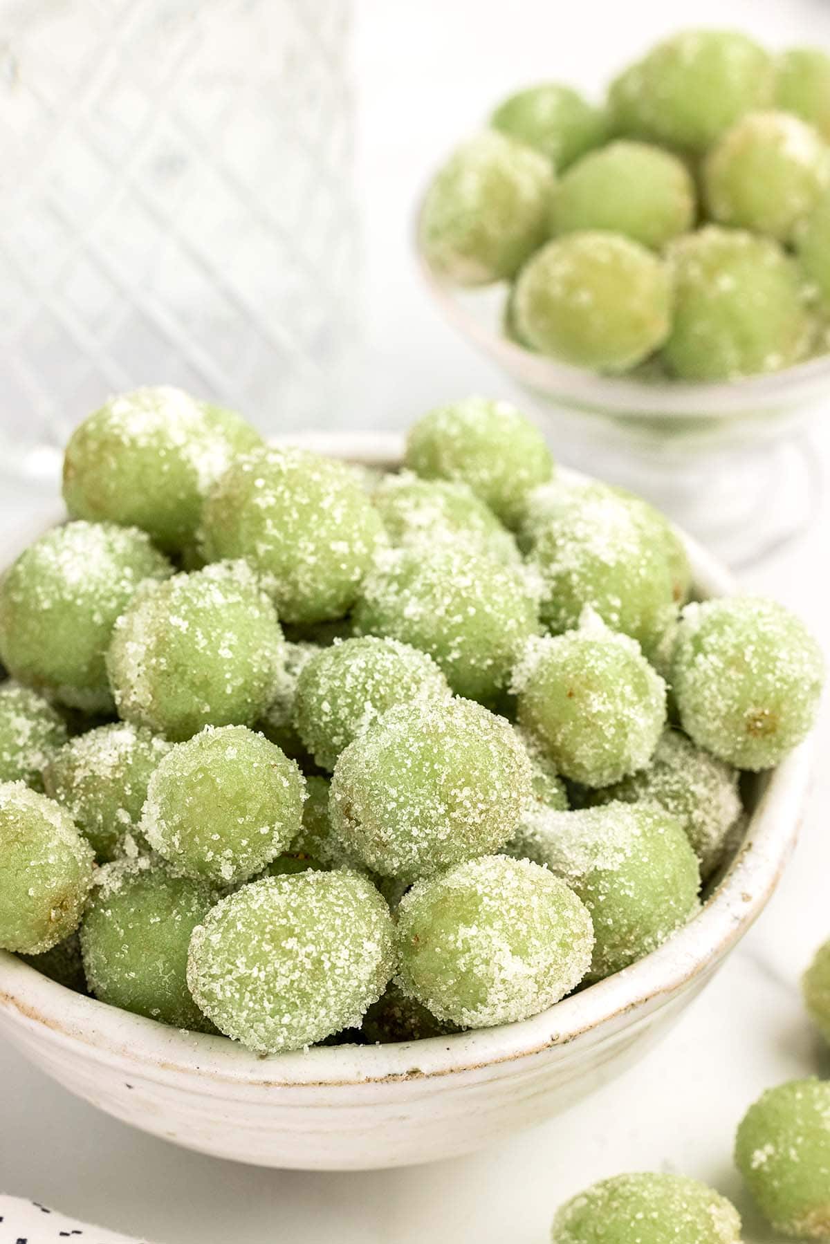 sugar coated grapes in a white large bowl.