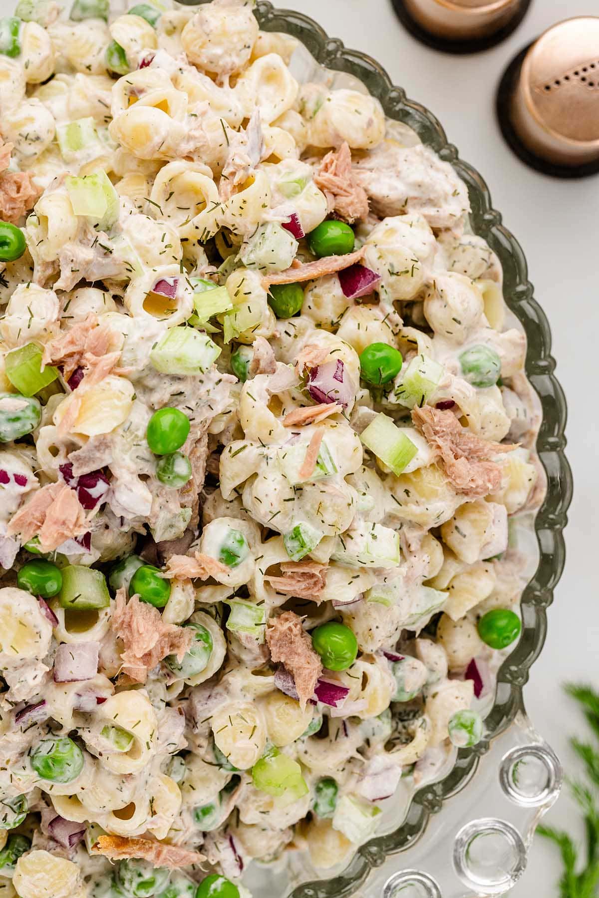 a bowl of Tuna Pasta Salad coated with salad dressing.