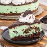a slice of thin mint cheesecake on a black plate.