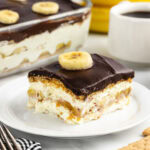 a slice of banana eclair cake on a plate.
