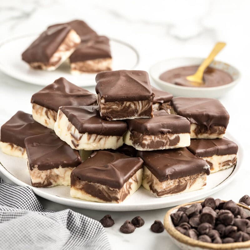 a couple of Boston Cream Fudge on a white plate.