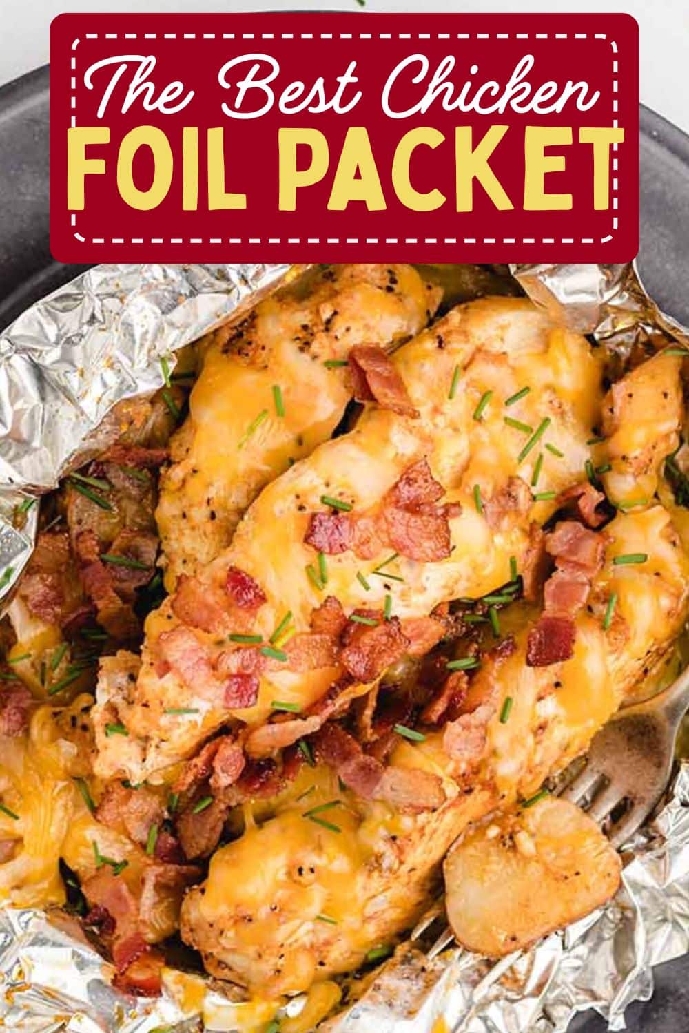 Top view close up of golden chicken foil packet inside aluminium foil wrapper.