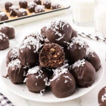 a couple of german chocolate truffles on a plate.