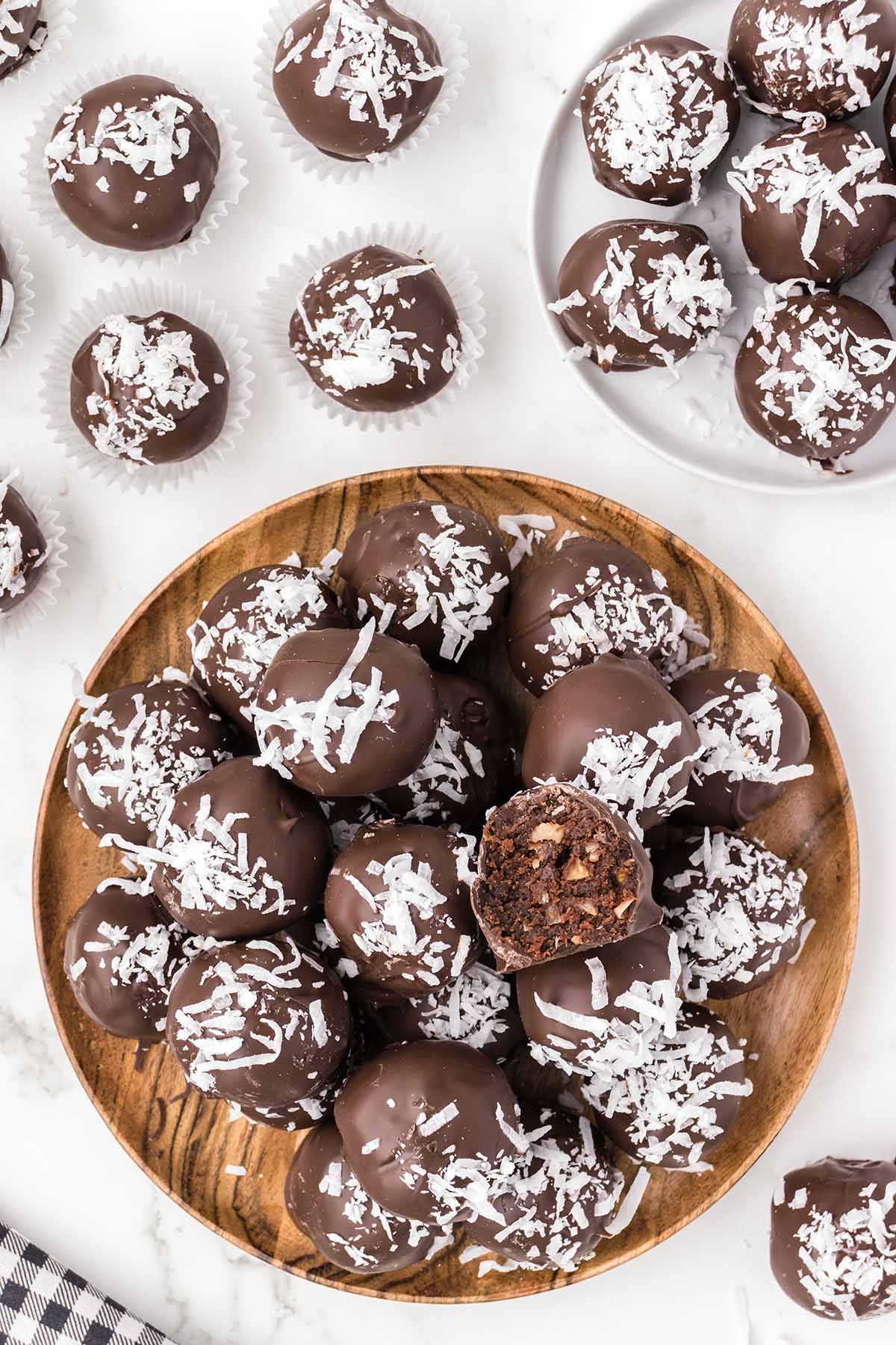a couple of German Chocolate Truffles served on wooden plate.