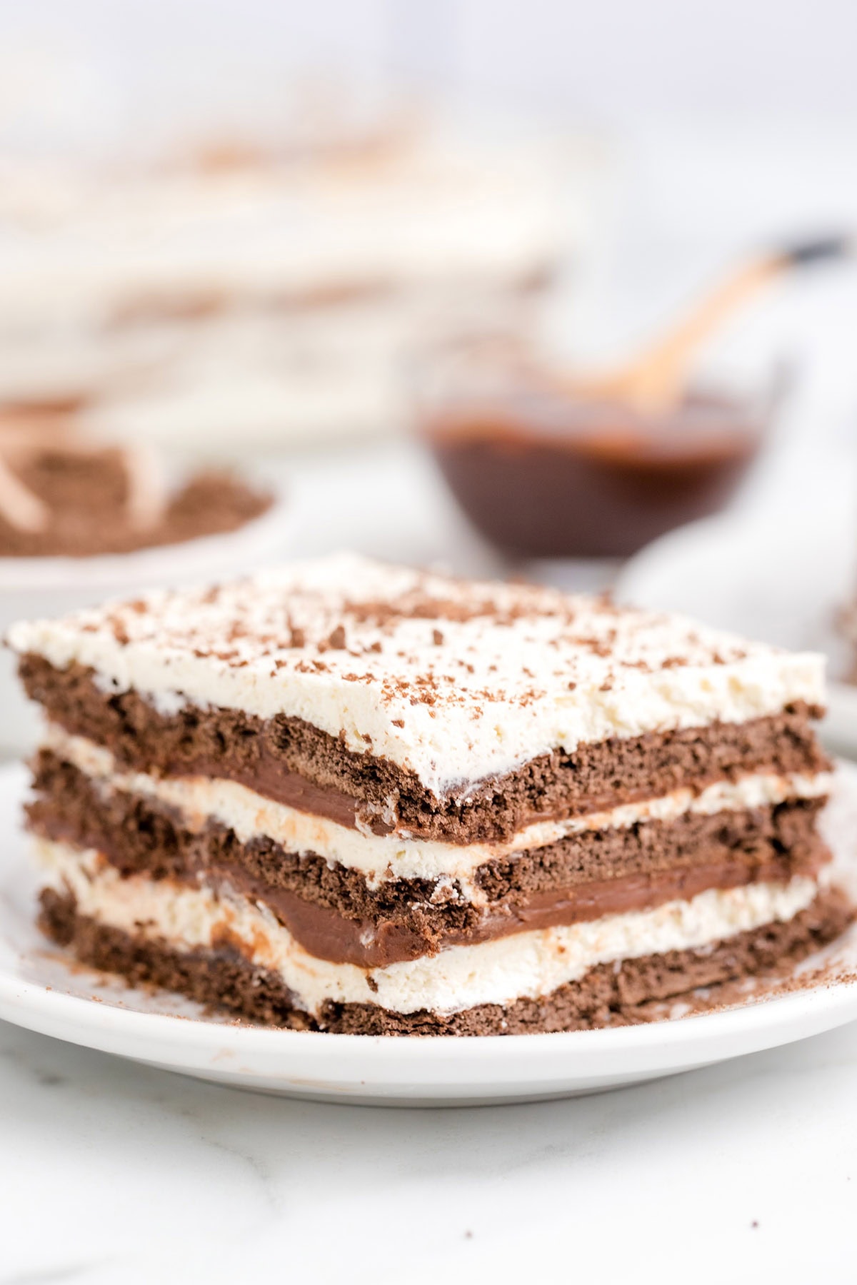 icebox cake with cream cheese mixture and chocolate graham cracker. 