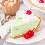 a slice of Pistachio Pie served on a white plate.