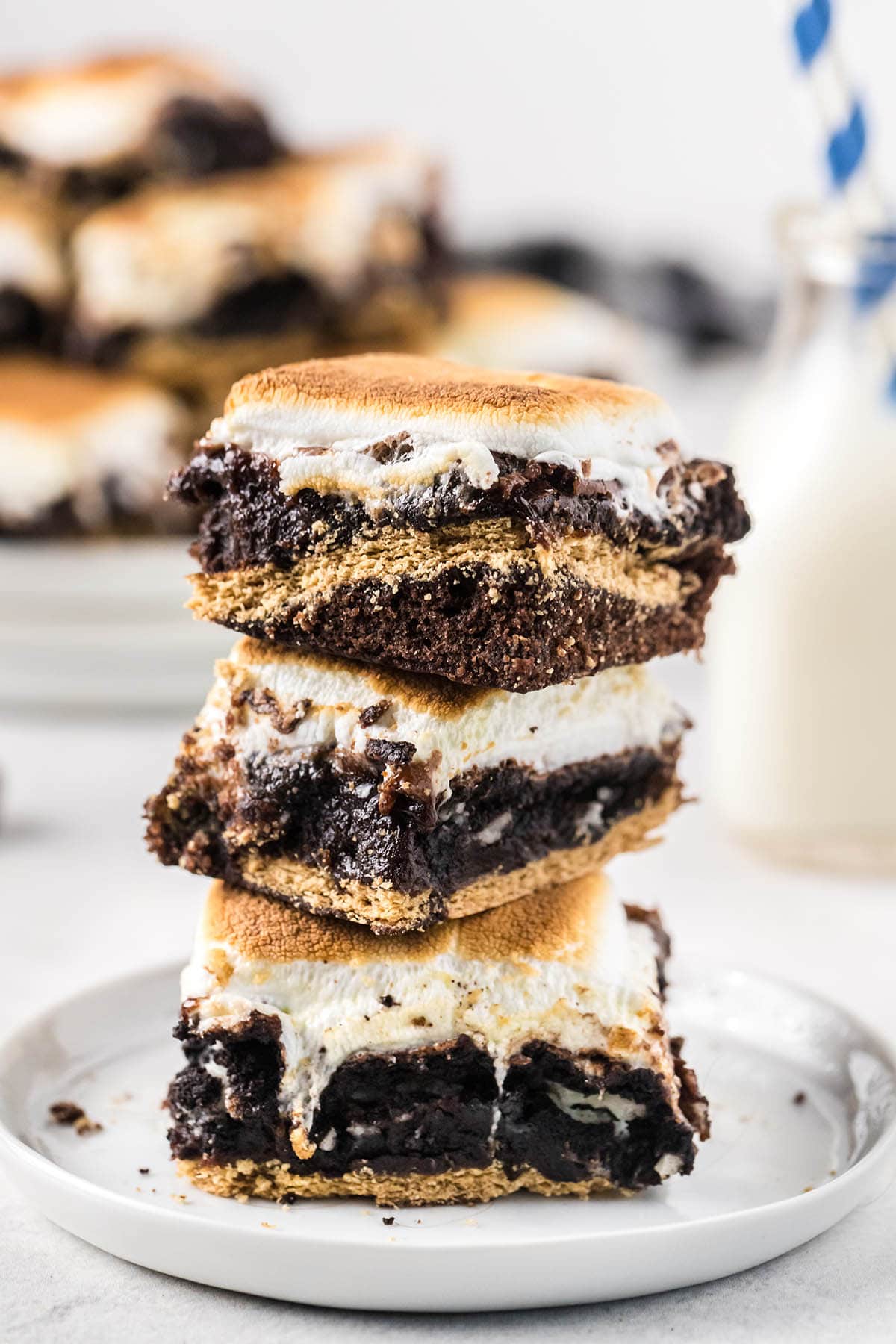 a couple of smore brownie stacked on a plate. 