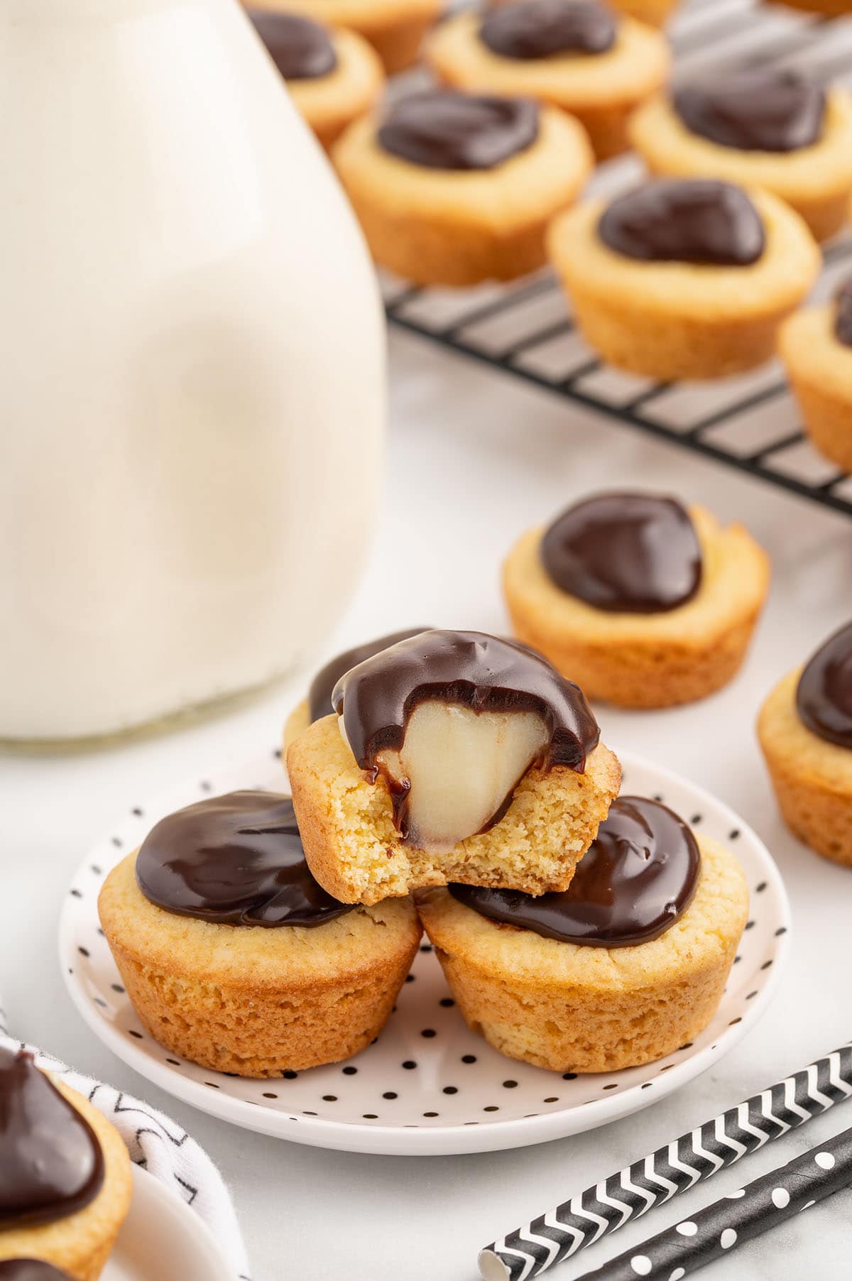 a stack of Boston Cream Pie Cookie Cups on a plate.