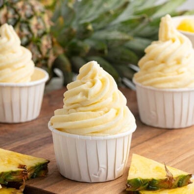 dole whip in white paper cups.