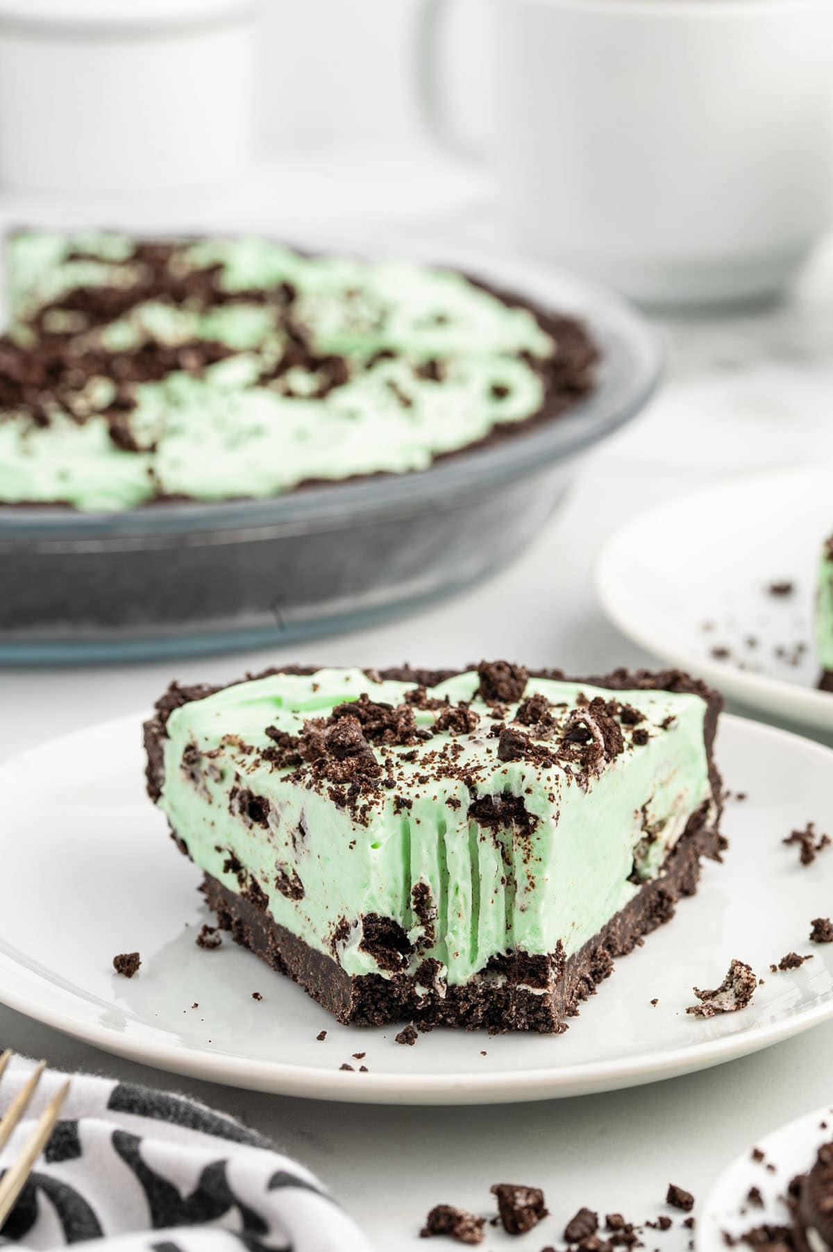a slice of Mint Chocolate Pie on a white plate.