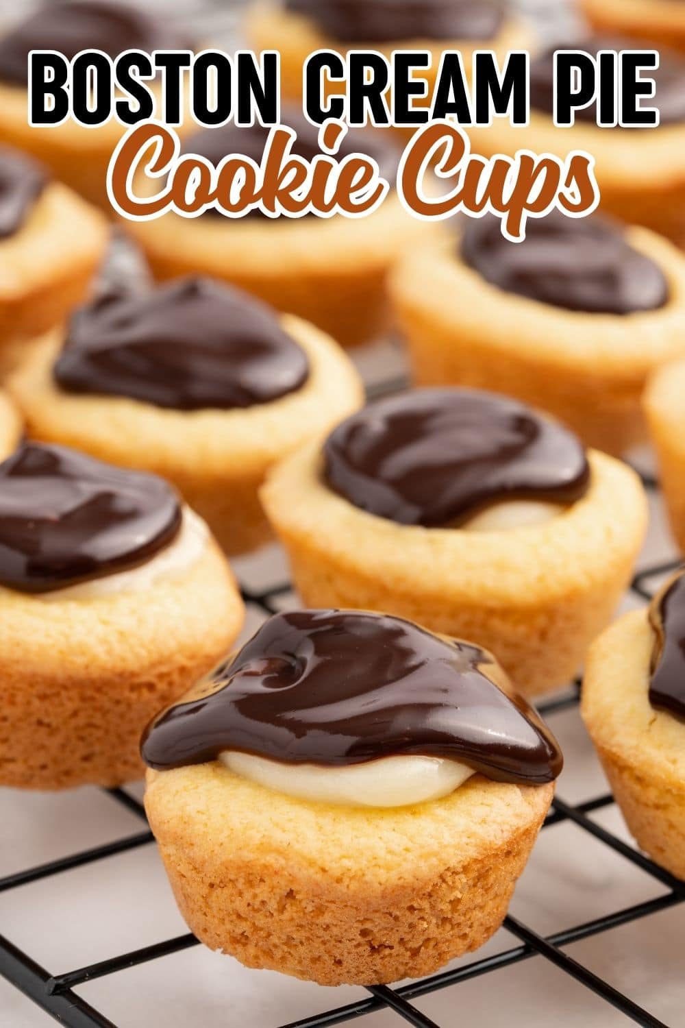 Boston Cream Pie Cookie Cups lined on a cooling rack
