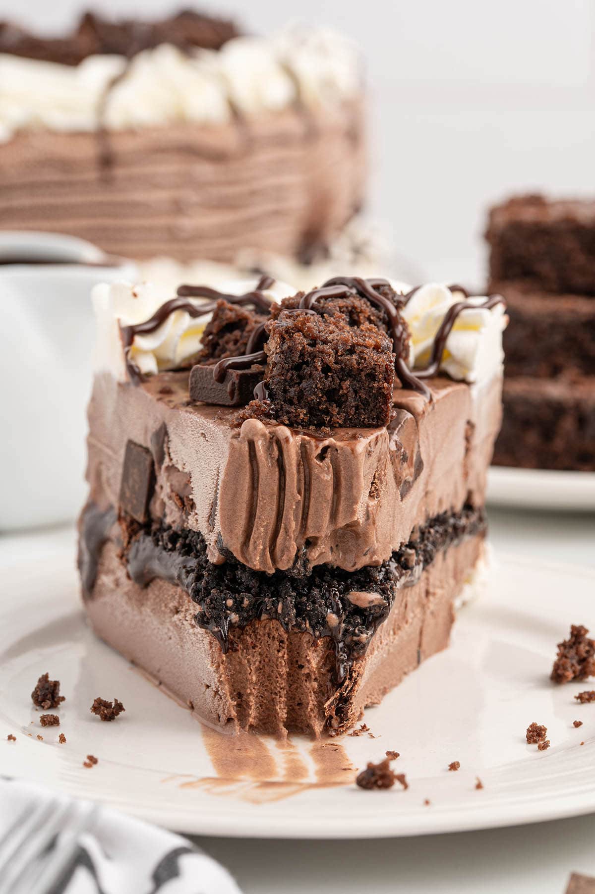 a slice of Dairy Queen Copycat Chocolate Ice Cream Cake on a white plate.