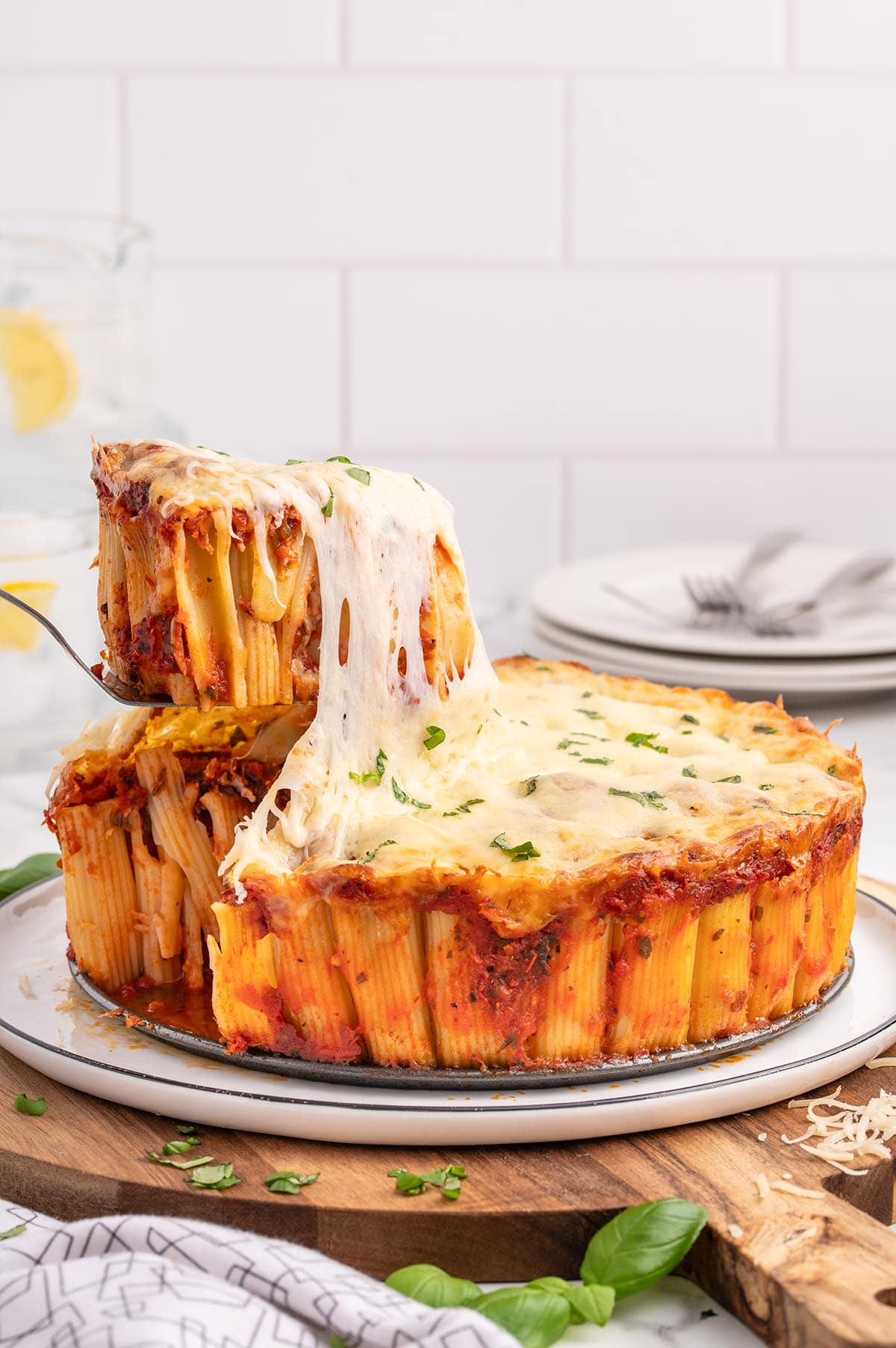 a slice of Honeycomb Pasta Cake being lifted from the whole dish.