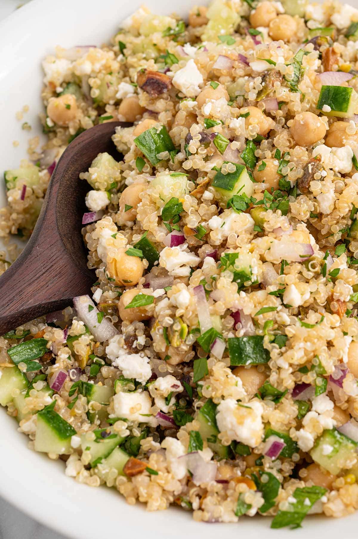 a bowl of Jennifer Aniston Salad with herbs and cheese.