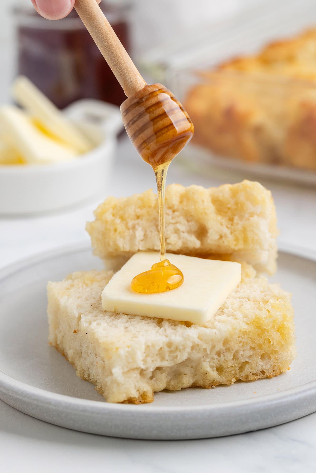 Butter Swim Biscuit served with a pat of butter and honey.