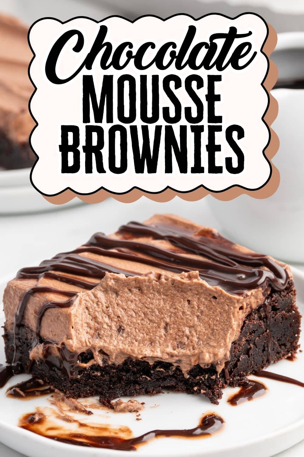 A slice of Chocolate Mousse Brownies that has been dug into with a spoon