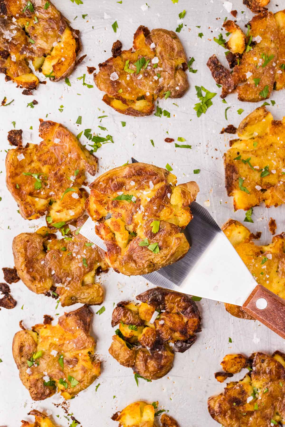 crispy smashed potatoes in baking sheet. 