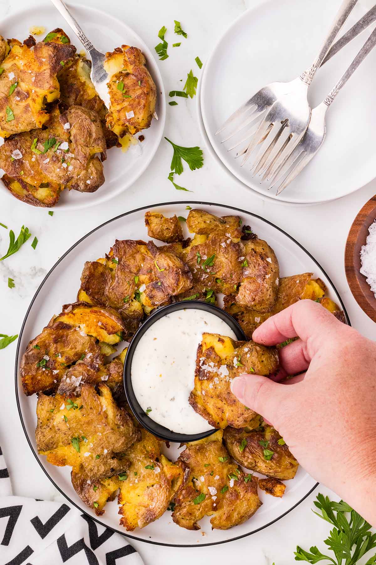 Crispy Smashed Potato dipped in ranch dressing.