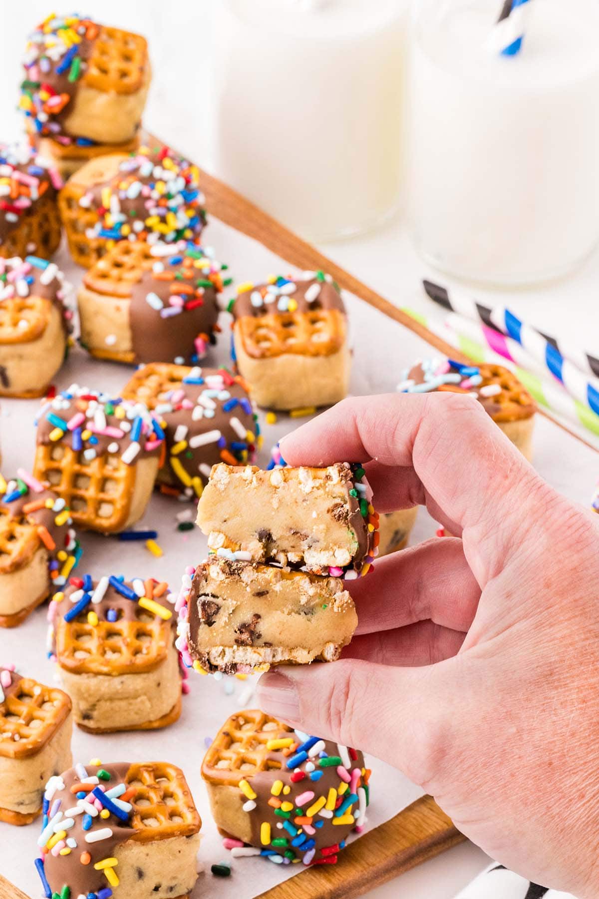 hand holding pretzel cookie dough bites. 