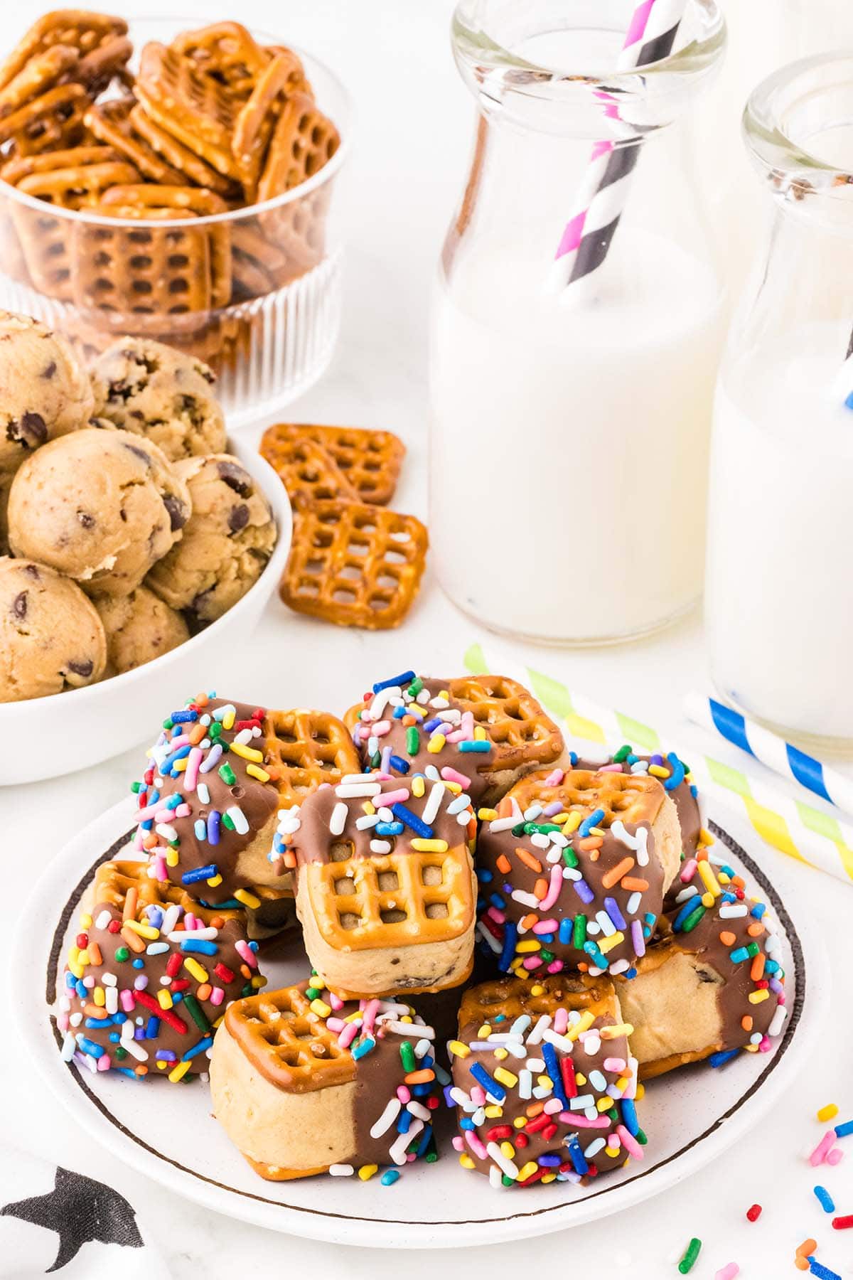 a couple of Pretzel Cookie Dough Bites on a white plate.