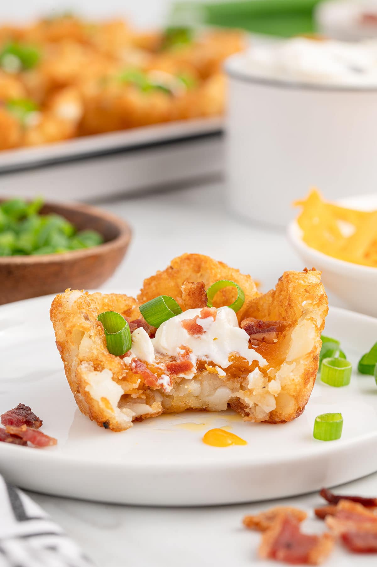 bitten loaded tater tot cups. 