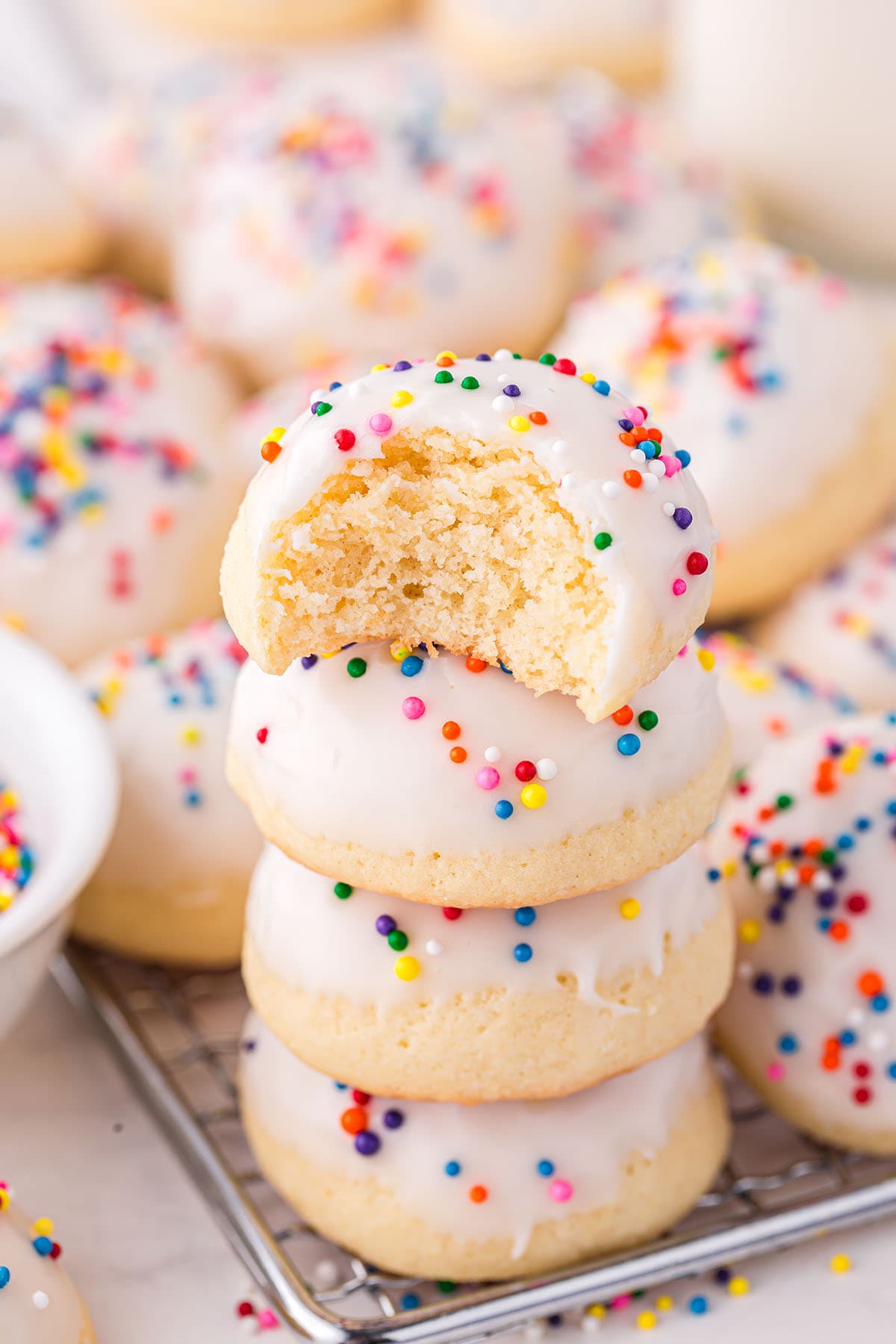 a stack of Italian Wedding Cookies with sprinkles.