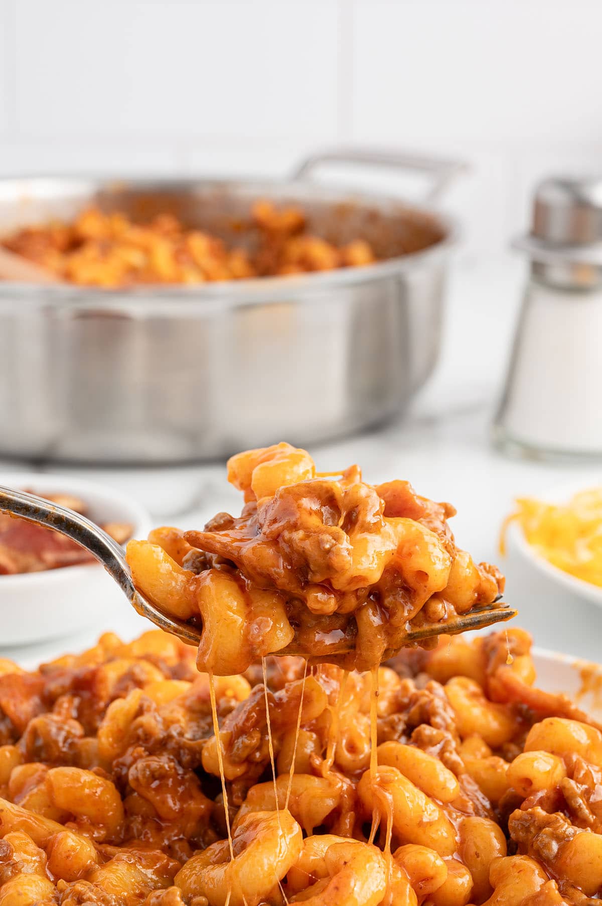 a bacon cheeseburger pasta with ground beef and melted cheese.