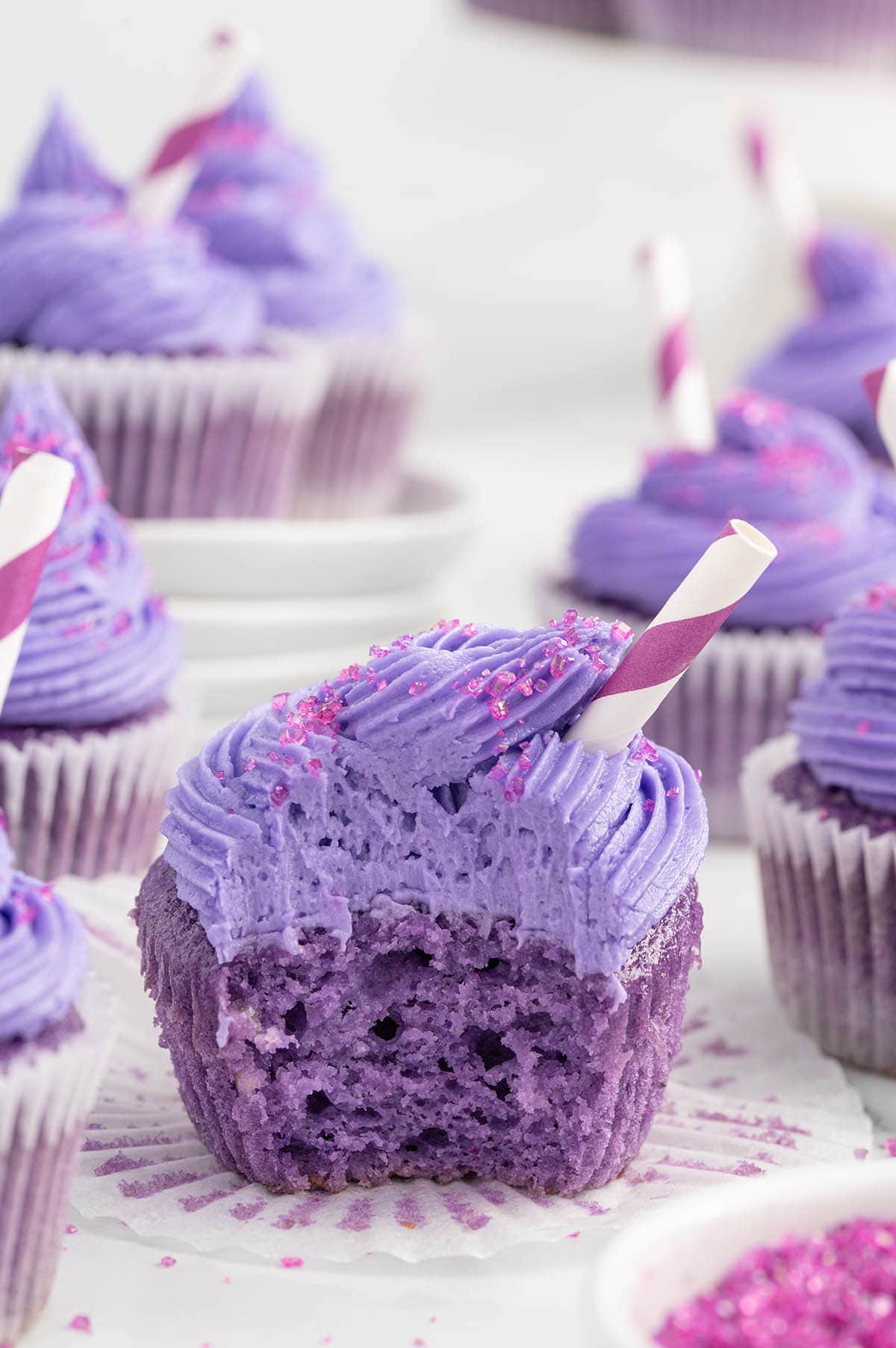 bitten grape soda cupcakes on the table.