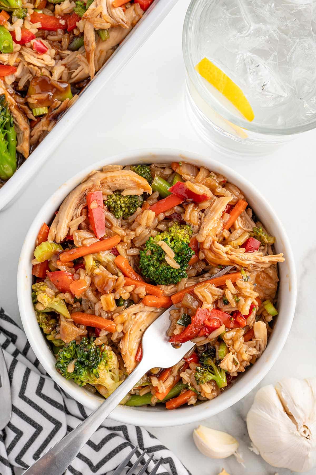 a bowl of Teriyaki Chicken Casserole on the table.