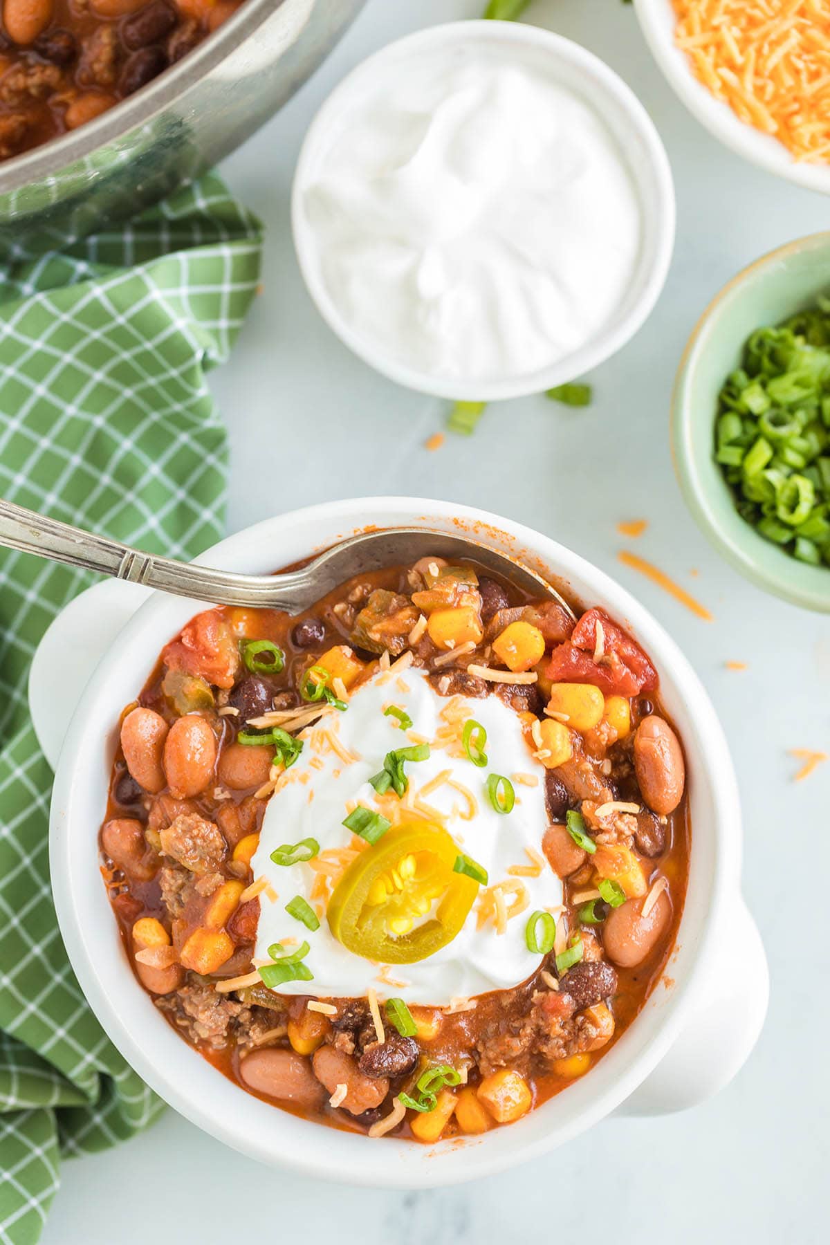 a bowl of taco soup with sour cream.