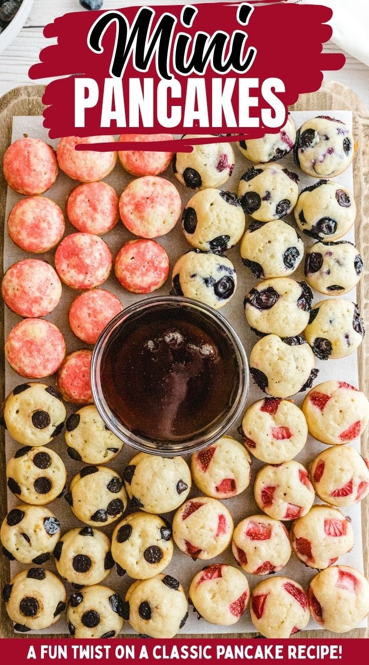 Top view of various flavour mini pancakes with a bowl of honey at the center