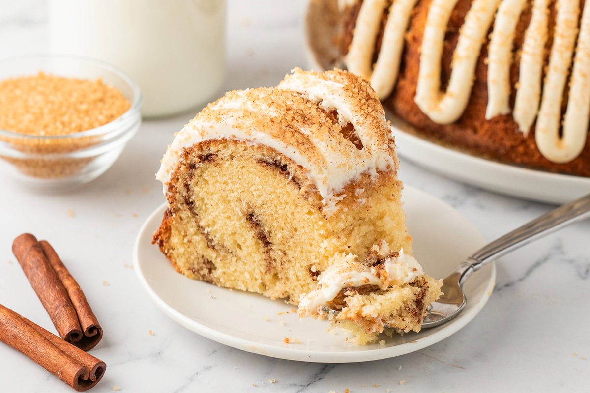 A slice of snickerdoodle bundt cake on a plate. 