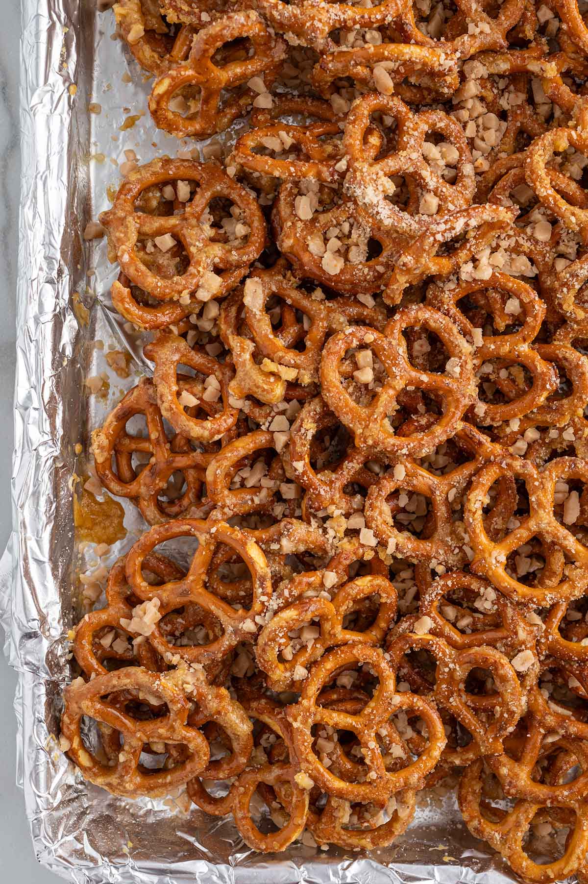 butter toffee pretzels on top of baking sheet. 