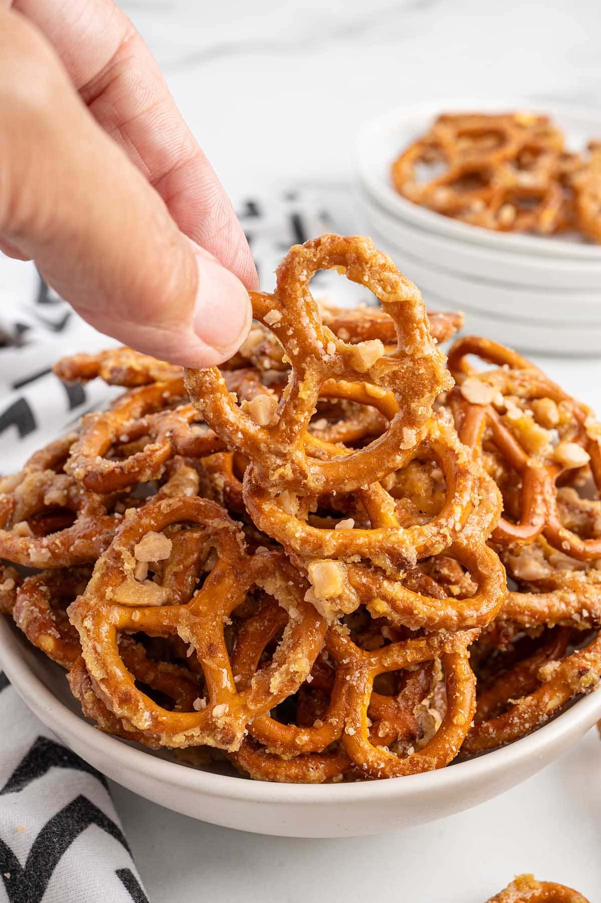 picked up a butter toffee pretzels with my hand.