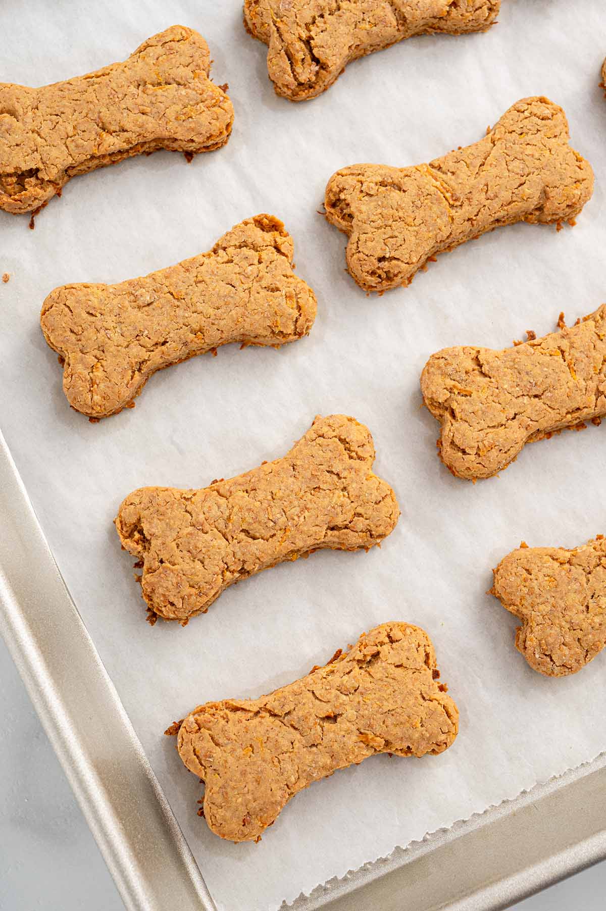 A freshly baked carrot cake on a baking sheet.