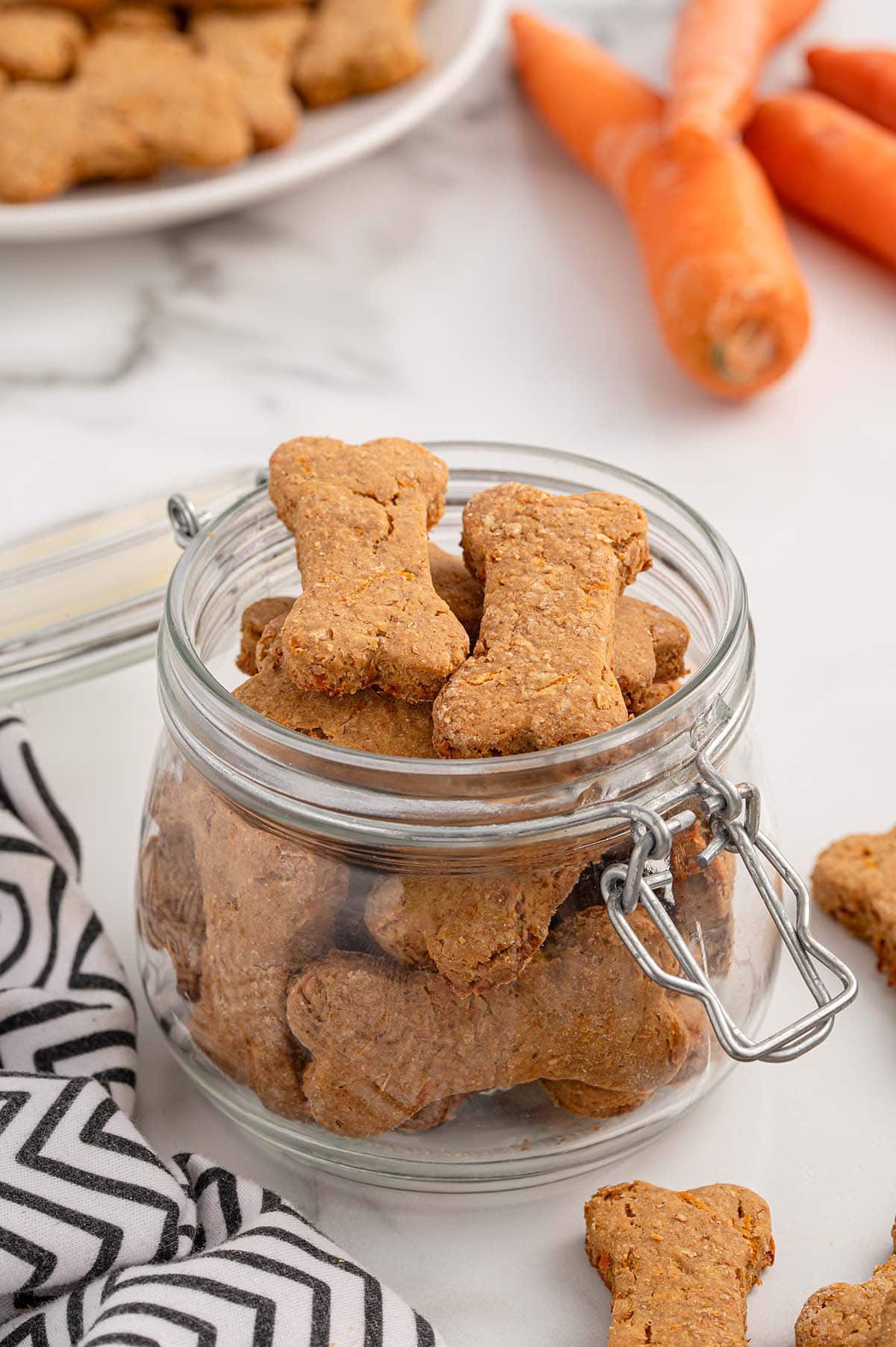 Baked dog carrot treats in a jar.