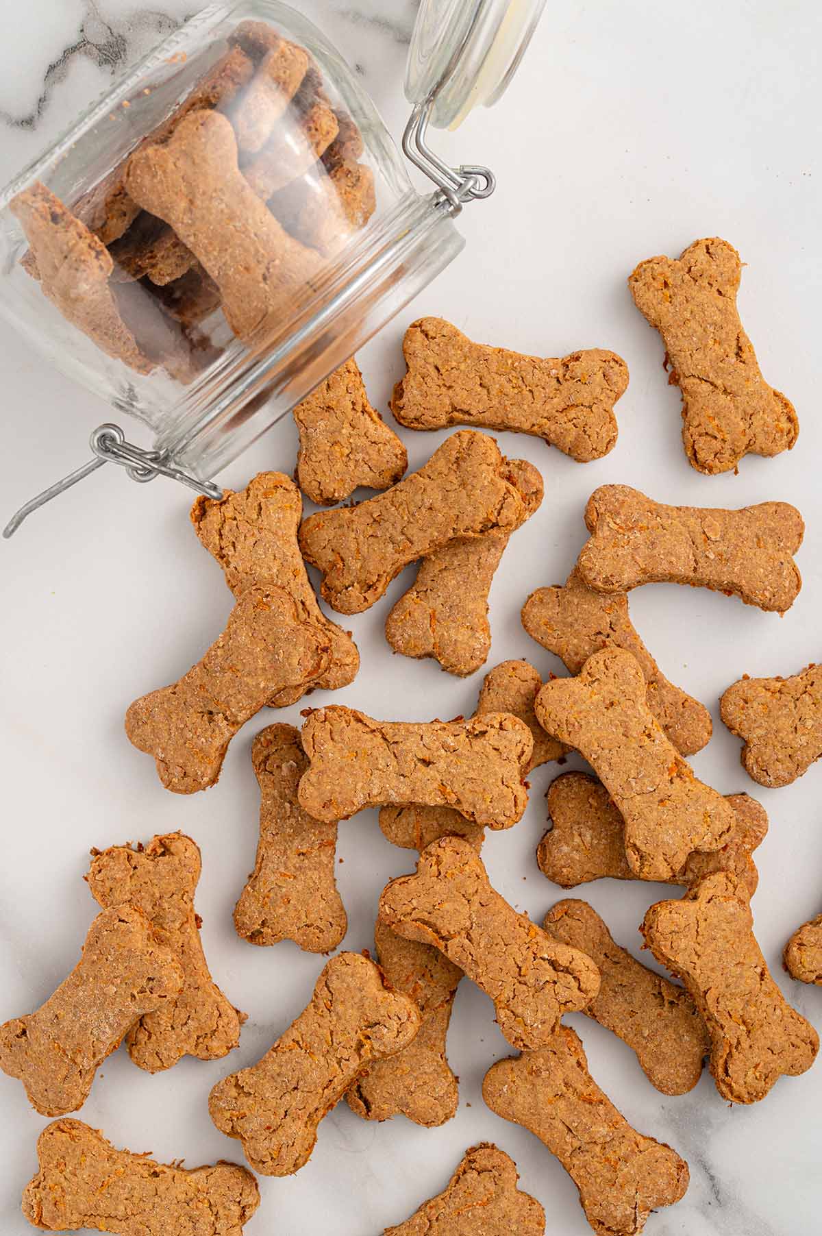 Carrot dog treats scattered on the table.