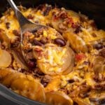 Crock Pot Cowboy Casserole with potatoes, beef, beans, and cheese.